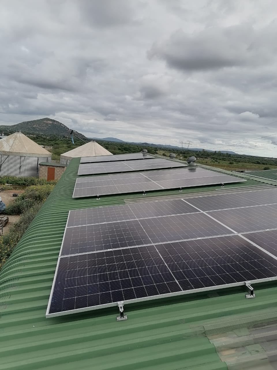 Tilt-frame modules on a low-pitch roof